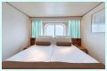 An old Holland America cruise ship is turning residential, letting travelers live at sea for $8,000 a month while it circumnavigates the globe